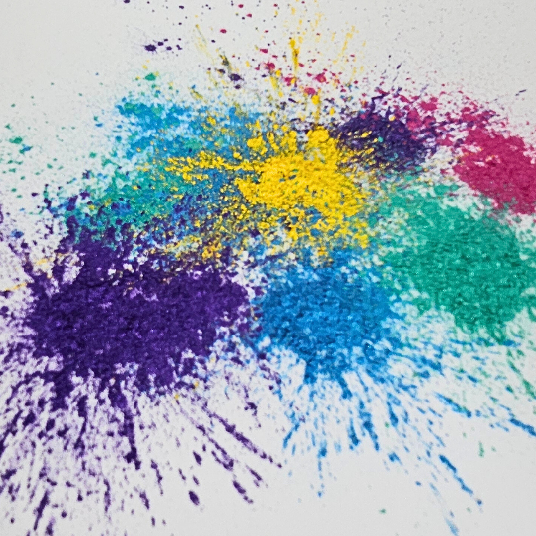 purple, blue, green, yellow and pink cosmetic colour mica powder on a white background