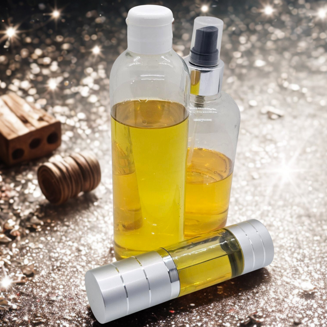 Three bottles with moringa body oil on a reflective surface